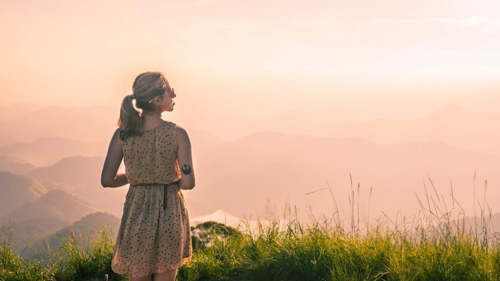 Girl in dress admires a view