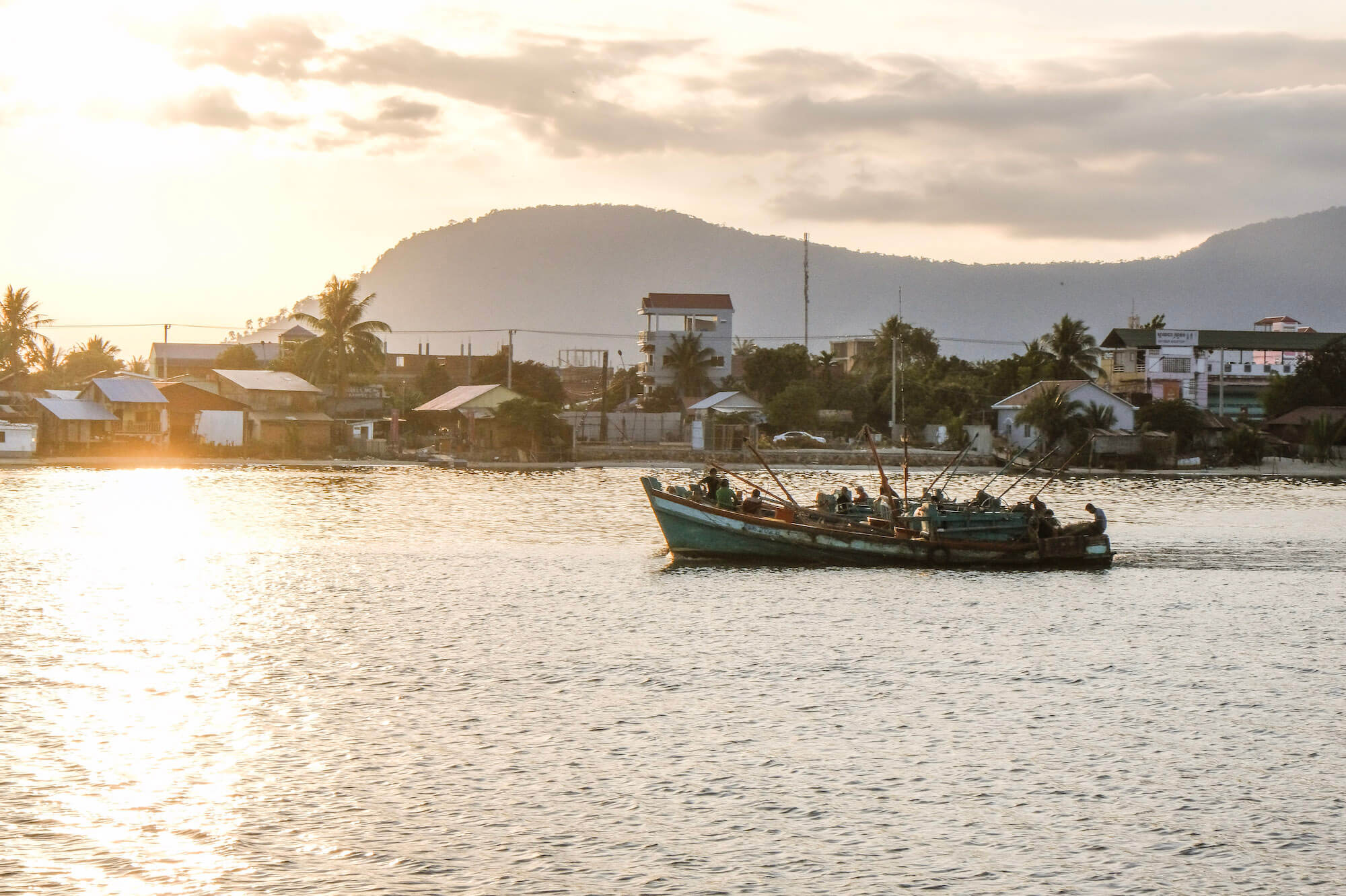 Sunset boat on river in Kampot