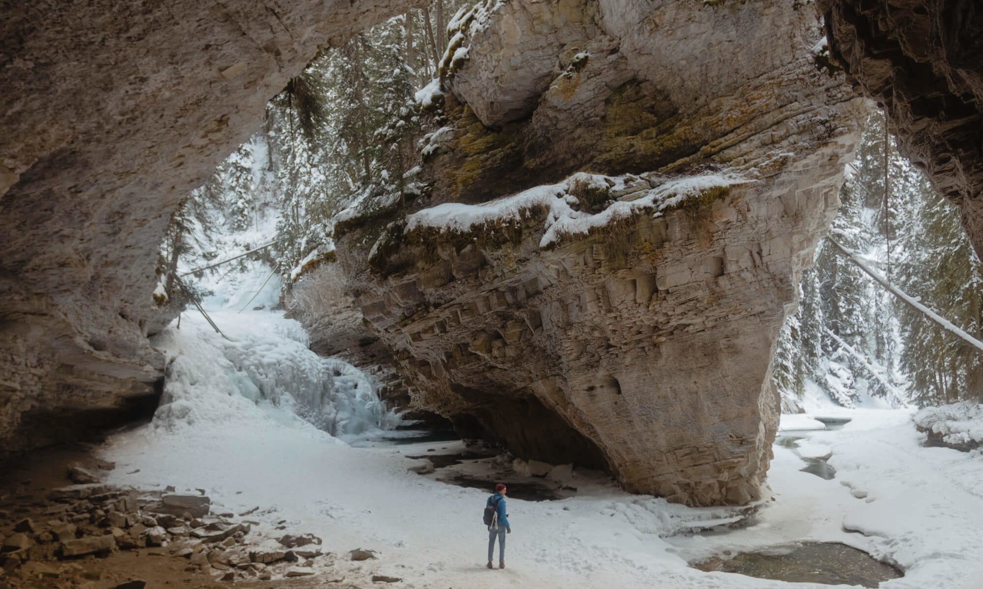 Man stands on frozen canyon